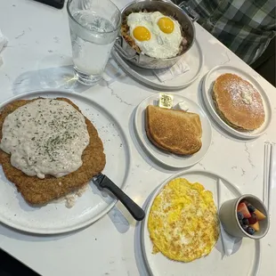 Country fried steak that came with eggs, fruit and toast.  Carnivore Skillet with sunny side eggs on top and pancakes.