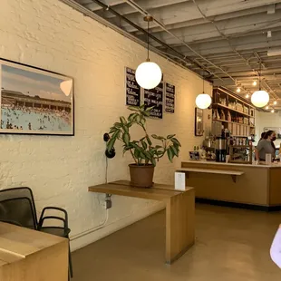 a woman standing in a coffee shop