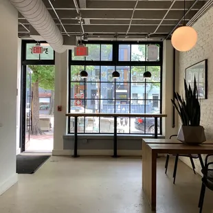 a view of a dining area with a table and chairs