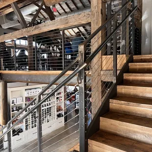a coffee shop with wooden stairs