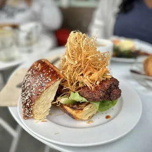 Fried chicken sandwich with haystack potatoes