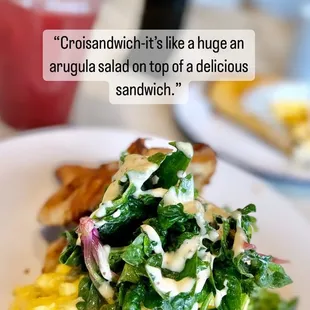 It is exactly a huge arugula salad on top of a delicious breakfast sandwich with house made croissant