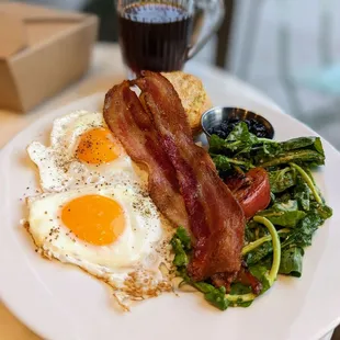 Thomas bfast. Eggs, bacon, biscuit &amp; jam, grilled greens &amp; tomato.. Yas, tomato.