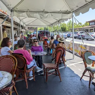 a group of people sitting at tables