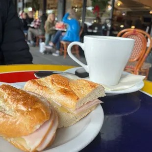 a sandwich and a cup of coffee