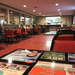 a restaurant with tables and chairs