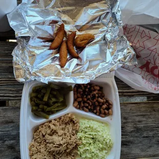 BBQ, cole slaw, green beans, back eyed peas, hush puppies.