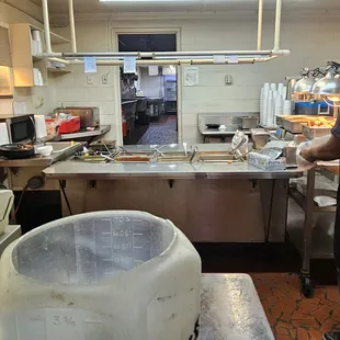 a man in a kitchen preparing food