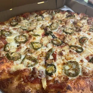 Pepperoni, sausage, jalapeño, and pineapple, large four topping 12.99+ tax