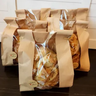 four bags of bread on a table