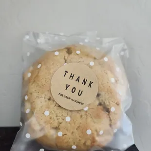 a bag of cookies with a thank you tag