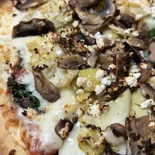a pizza with mushrooms and cheese