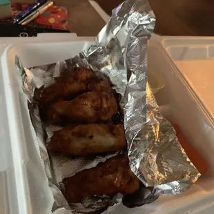 chicken wings wrapped in foil