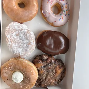 a variety of donuts in a box