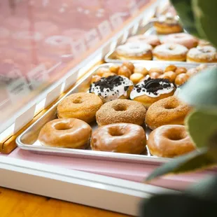 a tray of doughnuts on a table