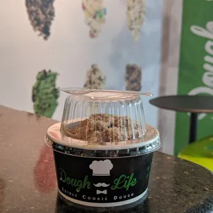 a cup of dough on a counter