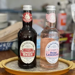 two bottles of ginger beer on a tray