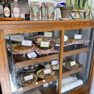 a display case filled with baked goods