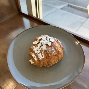 Almond Croissant coated with Powdered Sugar