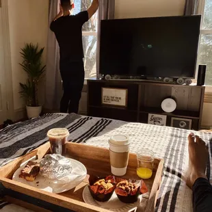 a man standing in front of a television