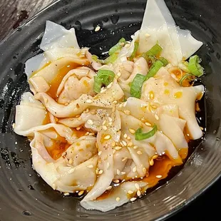 Boiled pork dumplings in chili sauce