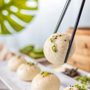 Our Q-Bao are tasty buns filled with moist pork and wrapped with half fluffy, half crispy dough.