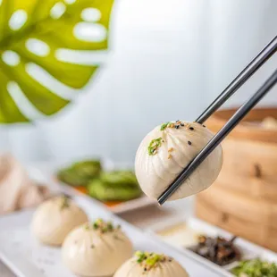 Our Q-Bao are tasty buns filled with moist pork and wrapped with half fluffy, half crispy dough.