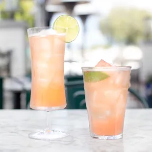 two cocktails on a table