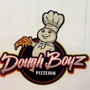 a chef holding a slice of pizza