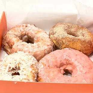 Clockwise from top left - glazed, cinnamon sugar, strawberry milk, coconut