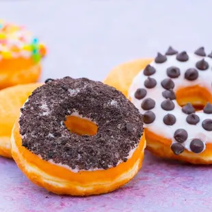 three different flavored donuts