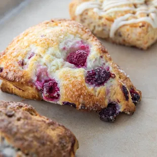 three pastries on a baking sheet
