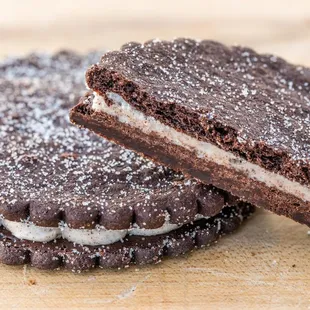 two chocolate cookies with cream filling