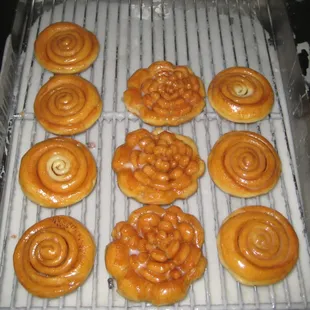 a bunch of doughnuts on a cooling rack