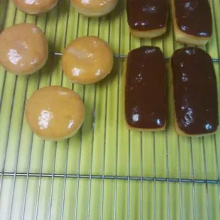 a variety of doughnuts on a cooling rack