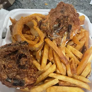 Burned Fried chicken dinner with burn French fries