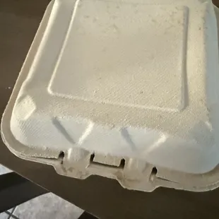 Sleazy cardboard box.