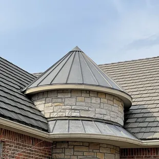 Tile roof repair with standing seam metal roof around the cone that was leaking for years