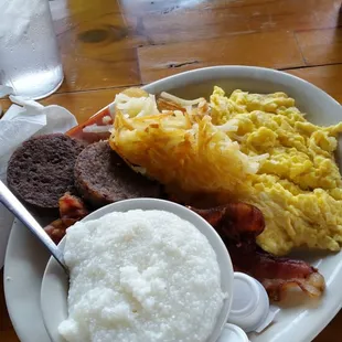 Scrambled eggs with cheese, grits, bacon sausage and ham. 2 flap Jacks and biscuits and gravy.  Great breakfast.