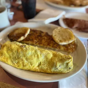 The Vegetarian Omelette, hash browns and English muffin, side of corned beef hash! Yum!