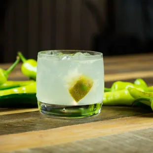 a glass of lemonade with a lime heart