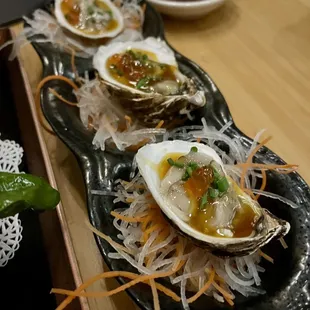 three oysters on a platter