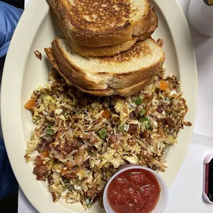 Texas hash with bacon. Ask for sourdough toast grilled, it's a game changer!!