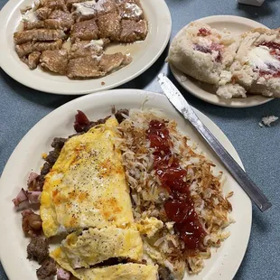 3-meat &amp; Cheese omelet, hash browns, Dove's Dove's Huge Biscuit and pancake for sharing.  Delicious!