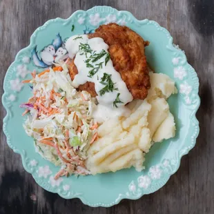 a plate of food on a wooden table