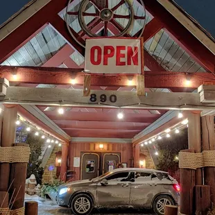 a car parked in front of a restaurant