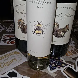 three bottles of wine on a table