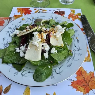 a plate of salad on a table