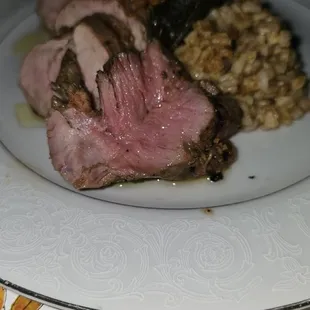 a plate of meat and rice