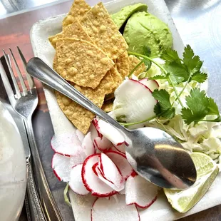 a plate of food and utensils